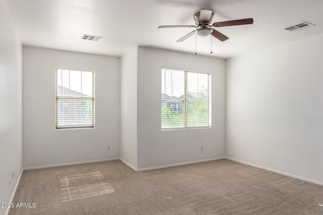 a view of a livingroom with a ceiling fan