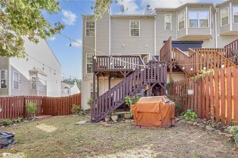 a backyard of a house with barbeque oven