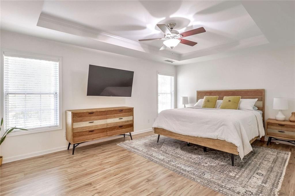 1622 Indian Way Cumming, GA 30040 - Photo 16 of 22 a bedroom with a bed and a flat screen tv