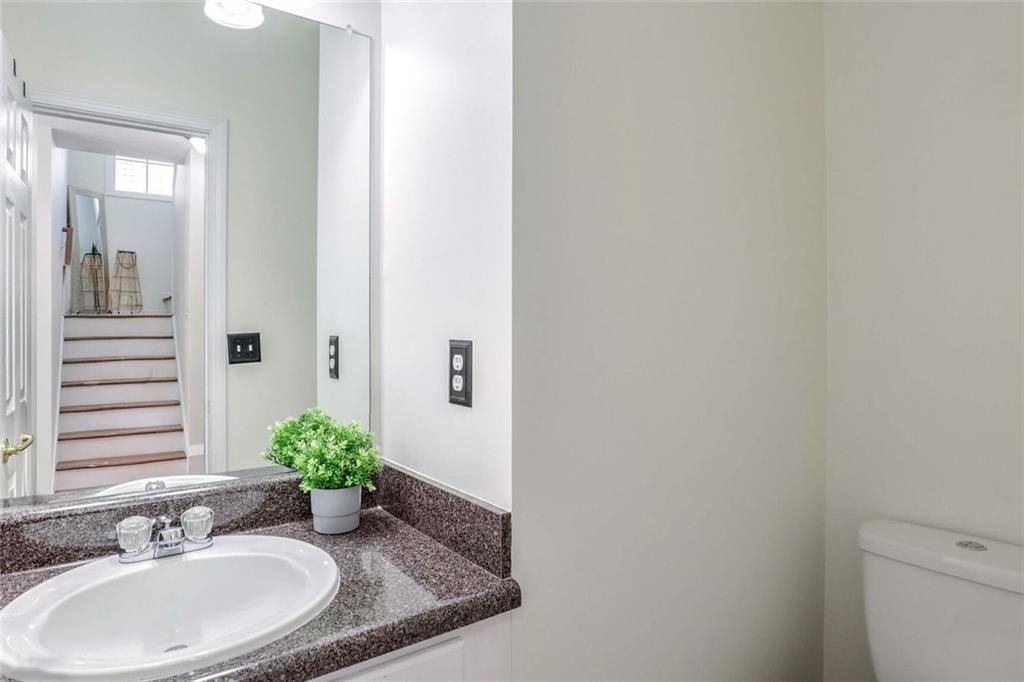 1622 Indian Way Cumming, GA 30040 - Photo 7 of 22 a bathroom with a sink and a mirror