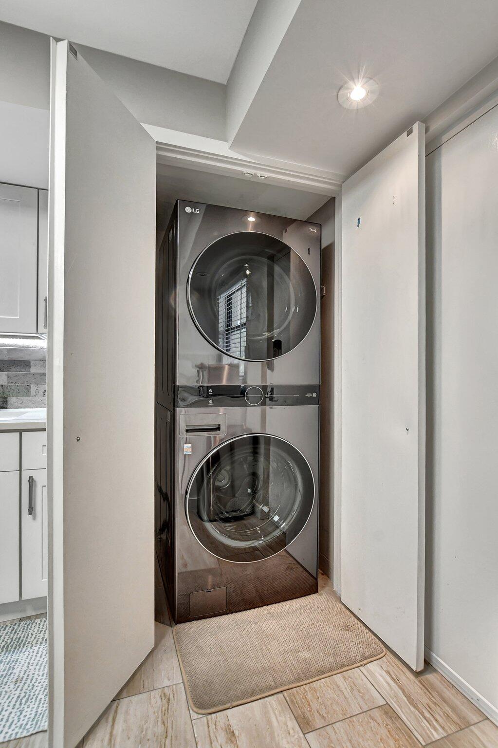 277 North Ocean Boulevard, Unit 3010 Boca Raton, FL 33432 - Photo 21 of 37 a view of washer and dryer in a utility room