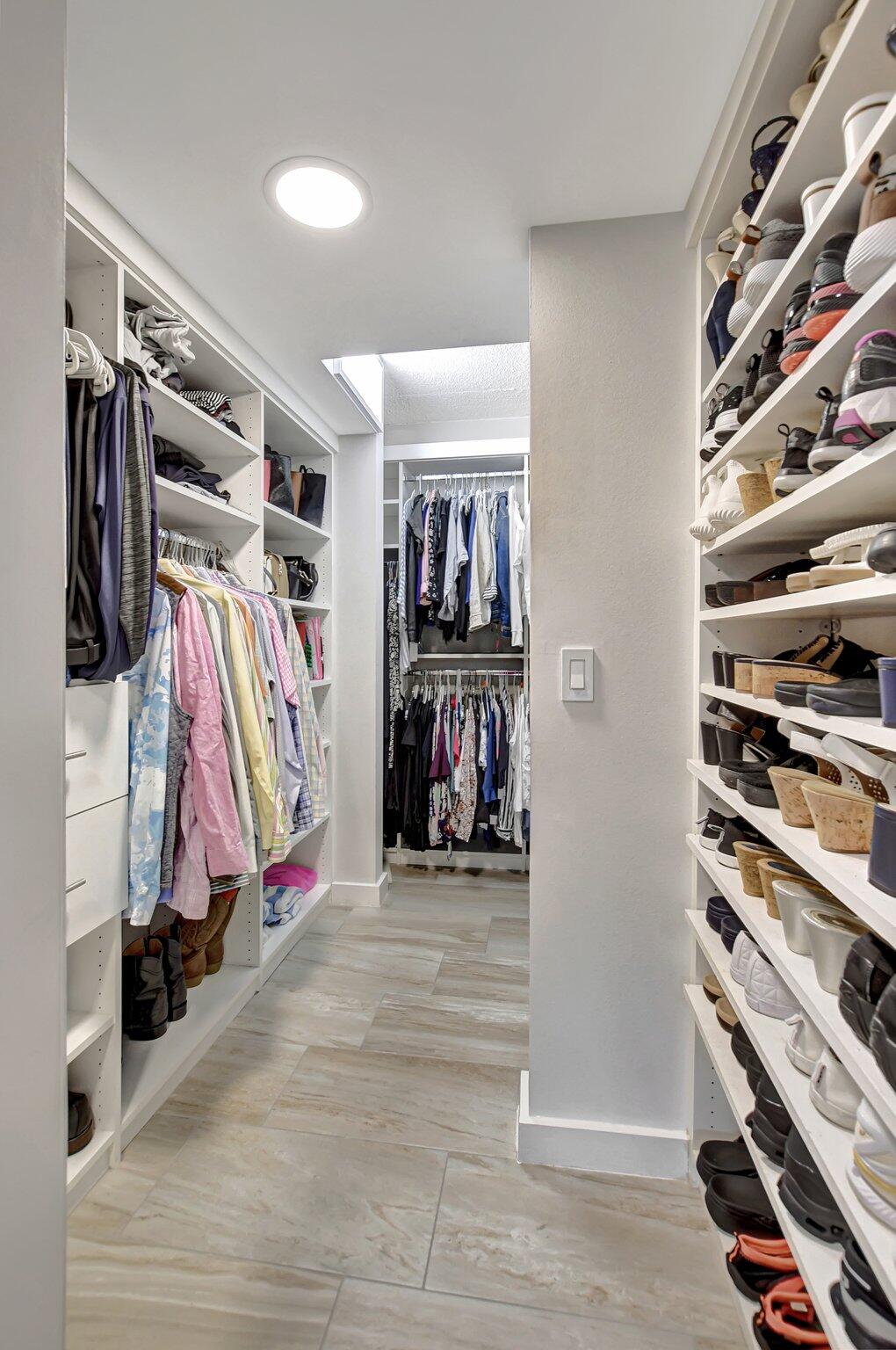 277 North Ocean Boulevard, Unit 3010 Boca Raton, FL 33432 - Photo 26 of 37 a view of walk in closet with clothes and shoes
