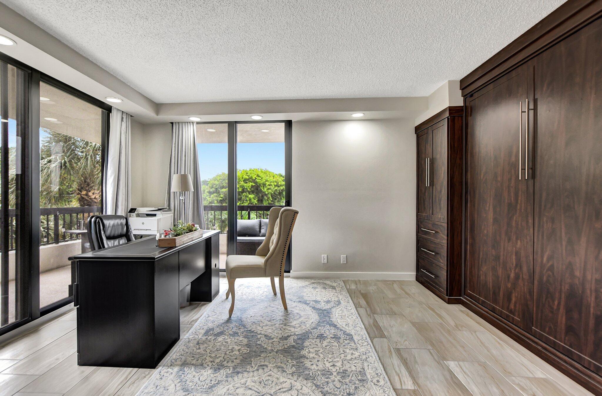 277 North Ocean Boulevard, Unit 3010 Boca Raton, FL 33432 - Photo 30 of 37 a living room with furniture and a large window