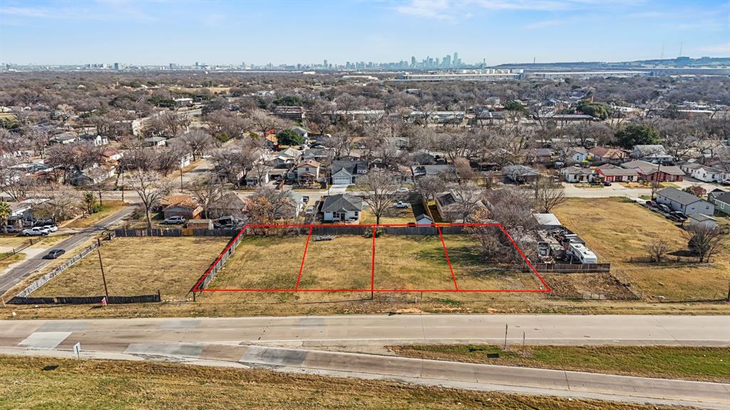 2706 Jeff Court Dallas, TX 75212 - Photo 3 of 14 Aerial view of residential area featuring property boundaries highlighted and city skyline