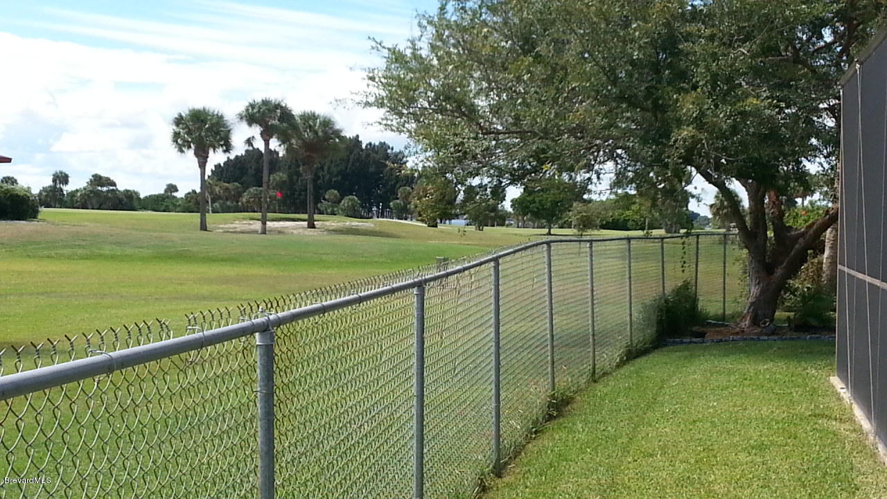 60 Country Club Road Cocoa Beach, FL 32931 - Photo 15 of 16 country club back yard fence