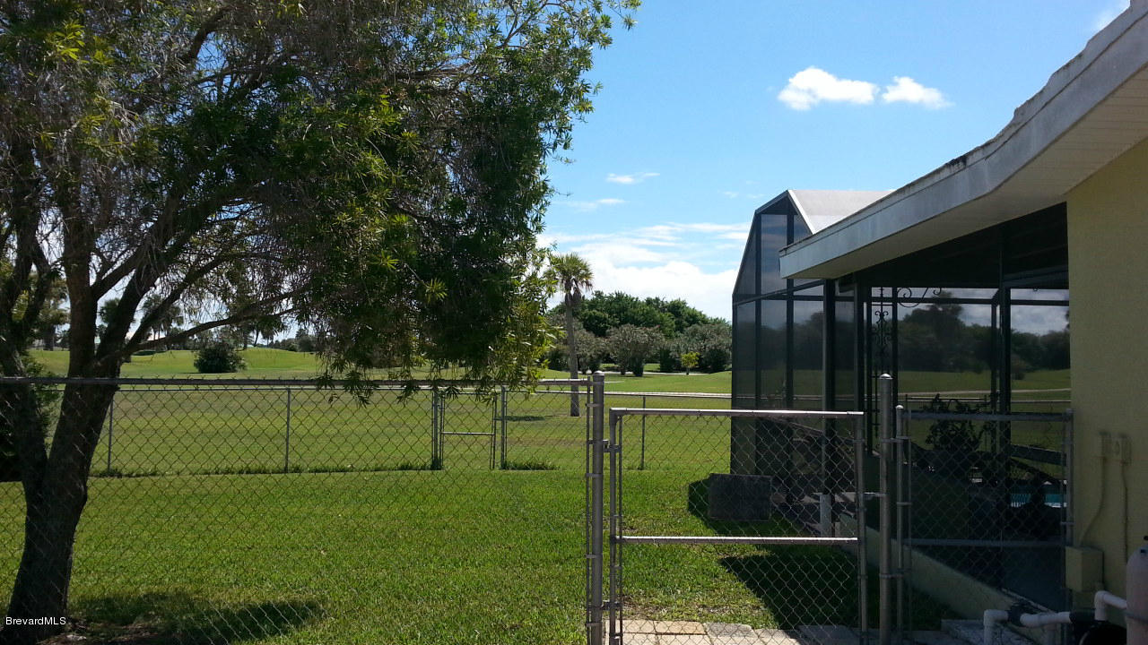 60 Country Club Road Cocoa Beach, FL 32931 - Photo 3 of 16 Side of House