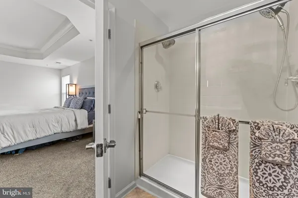 a bedroom with a bed and a mirror