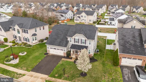 a aerial view of a house with a yard