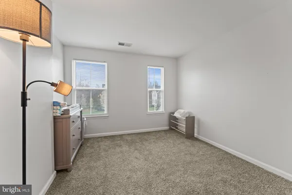 a room with bed and a window