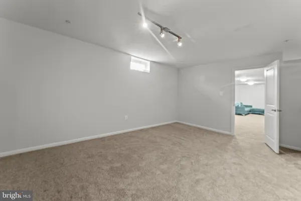 an empty room with a empty space and windows