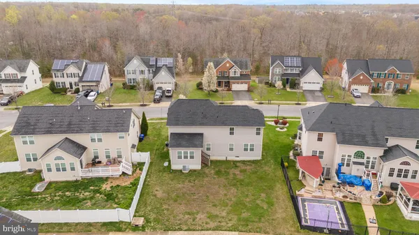 a aerial view of a house with swimming pool and sitting area