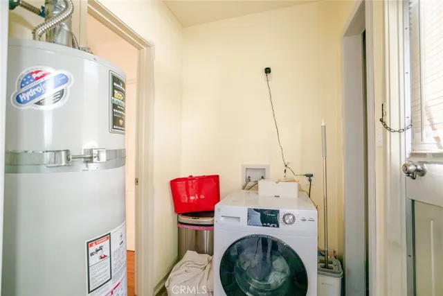 a utility room with multiple dryer and washer
