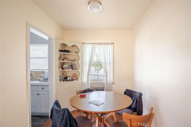 a view of a dining room with furniture and window