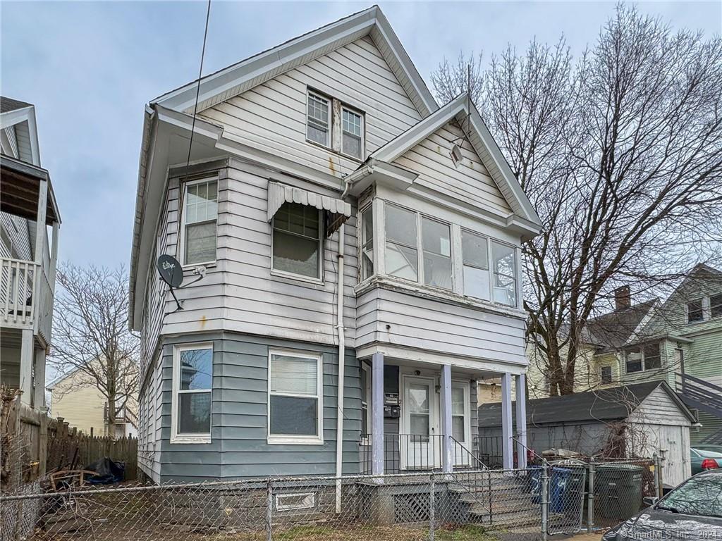 26 Pleasant Street Bridgeport, CT 06608 - Photo 14 of 15 a view of a house with a yard