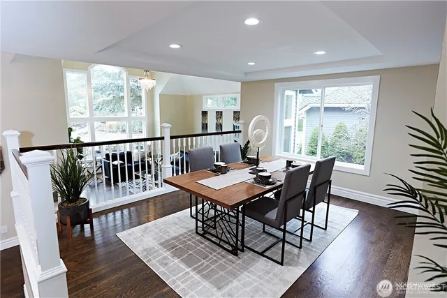 a view of a dining room with furniture window and wooden floor