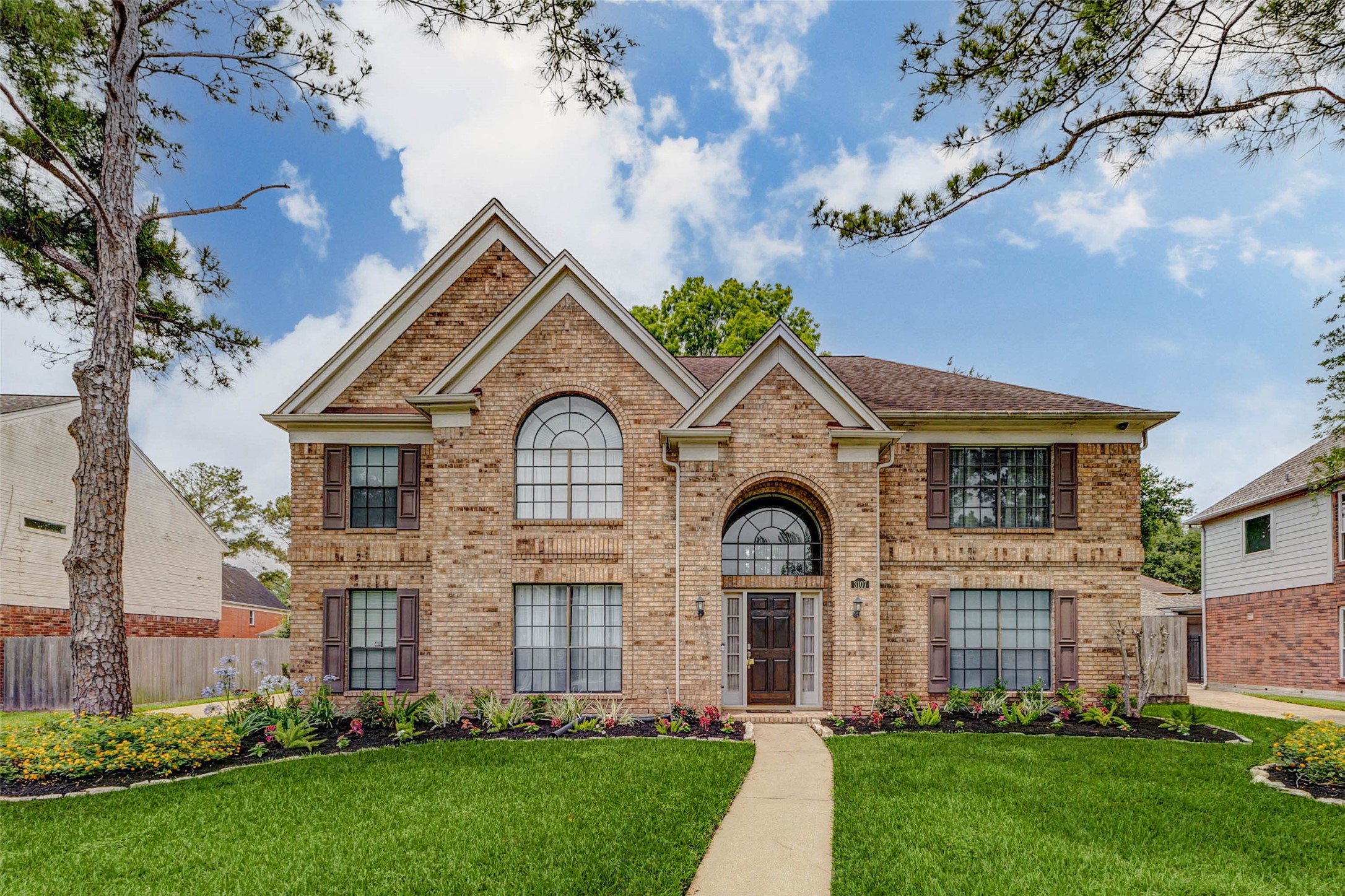 3107 Dulaney Road Houston, TX 77084 - Photo 2 of 50 a front view of a house with a garden