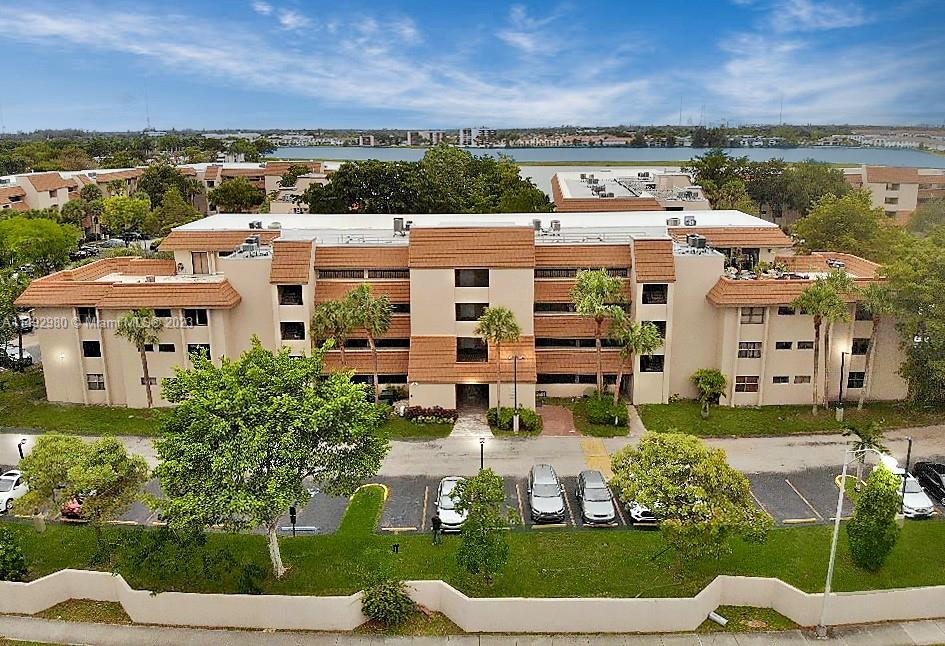 an aerial view of multiple house with a yard