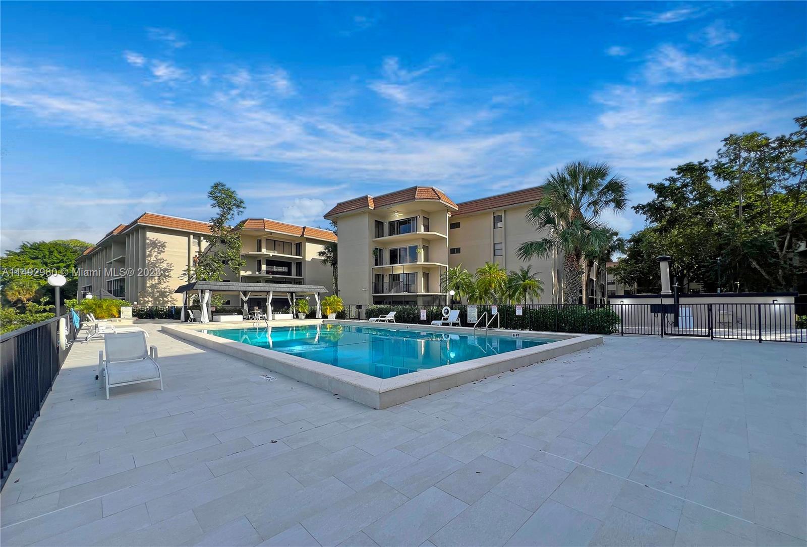 491 Ives Dairy Road, Unit 3055 Miami, FL 33179 - Photo 15 of 24 a view of a house with a yard and large trees
