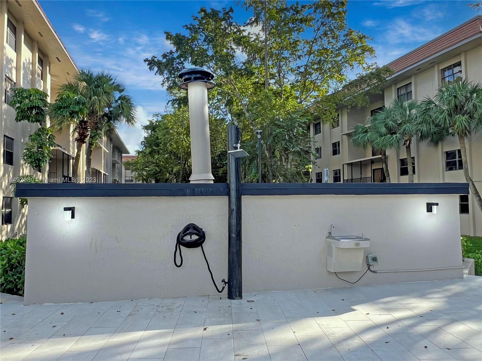 491 Ives Dairy Road, Unit 3055 Miami, FL 33179 - Photo 21 of 24 a street view along with tall trees