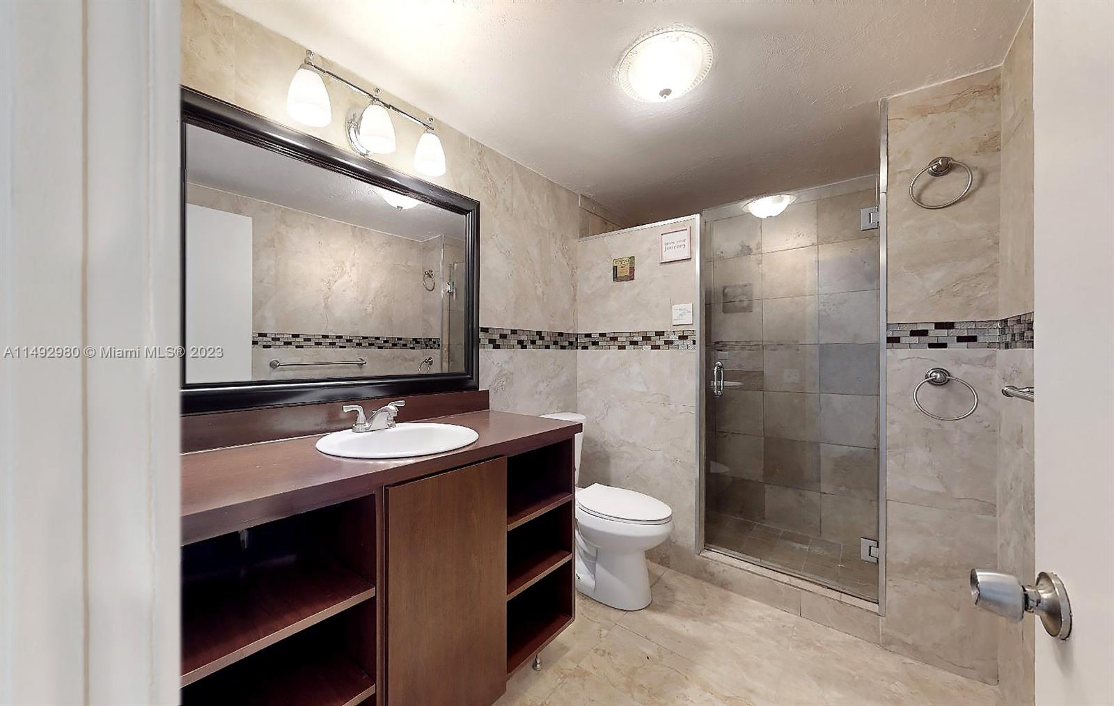 491 Ives Dairy Road, Unit 3055 Miami, FL 33179 - Photo 8 of 24 a bathroom with a sink and a mirror