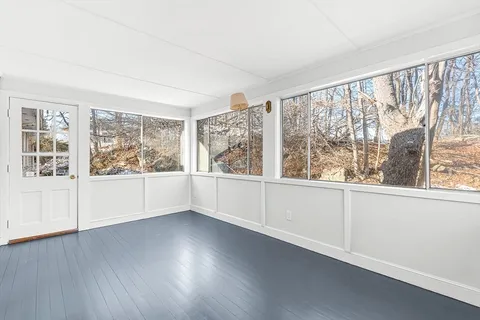 a bathroom with a granite countertop sink a toilet and shower