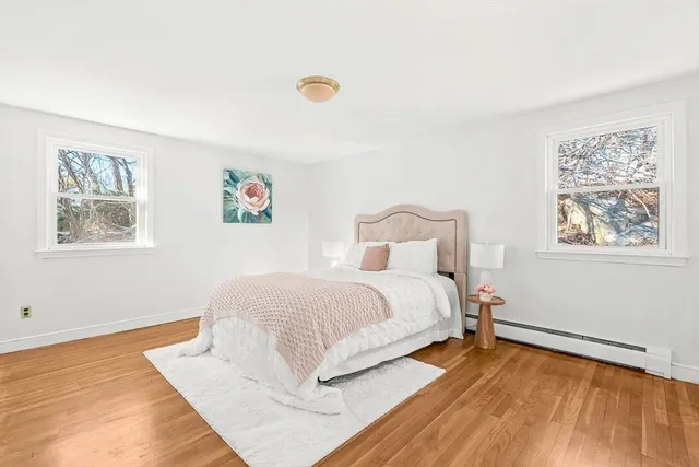 a large white bed in a white room