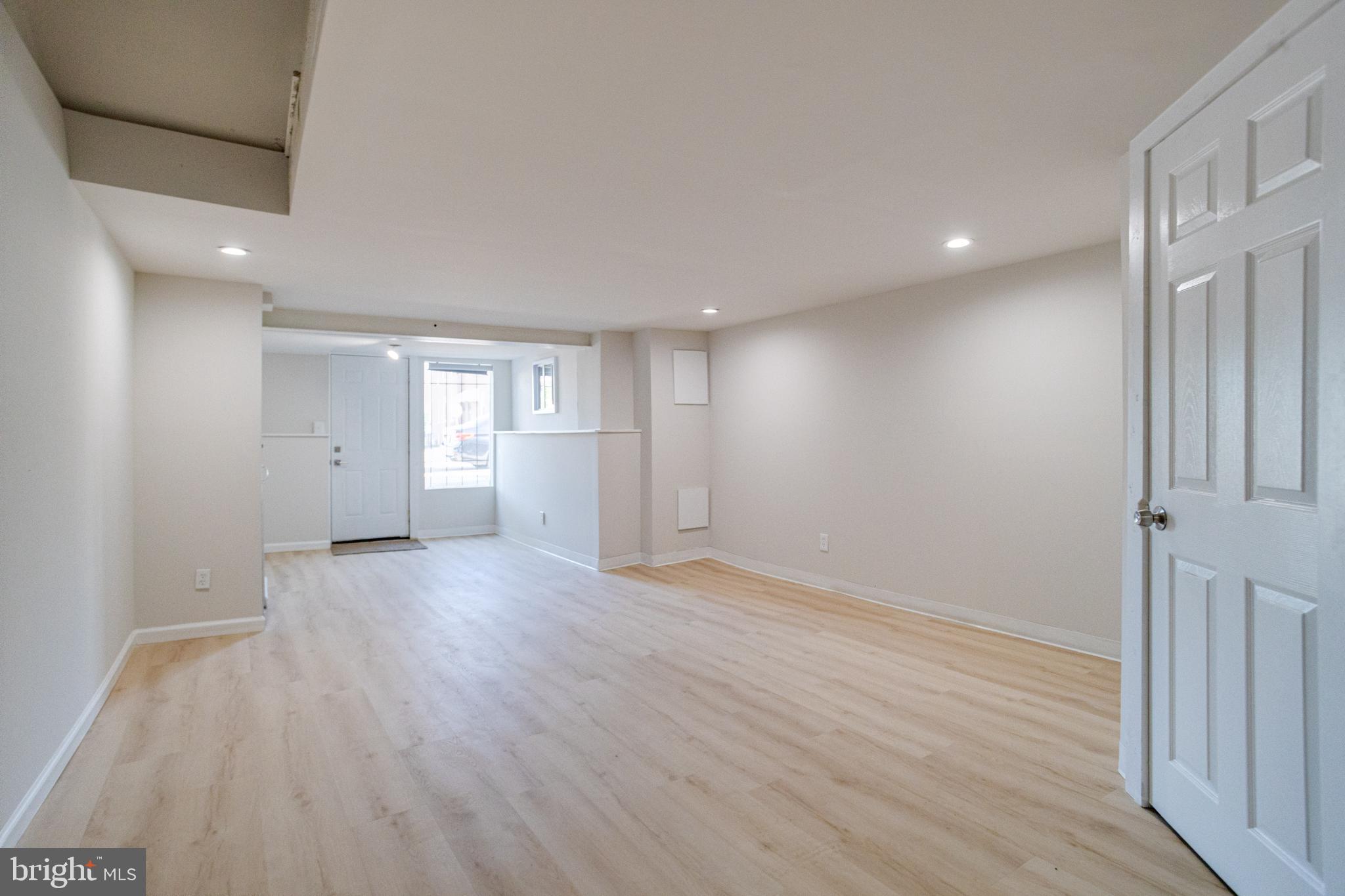5878 Belair Road Baltimore, MD 21206 - Photo 37 of 41 wooden floor in an empty room with a window