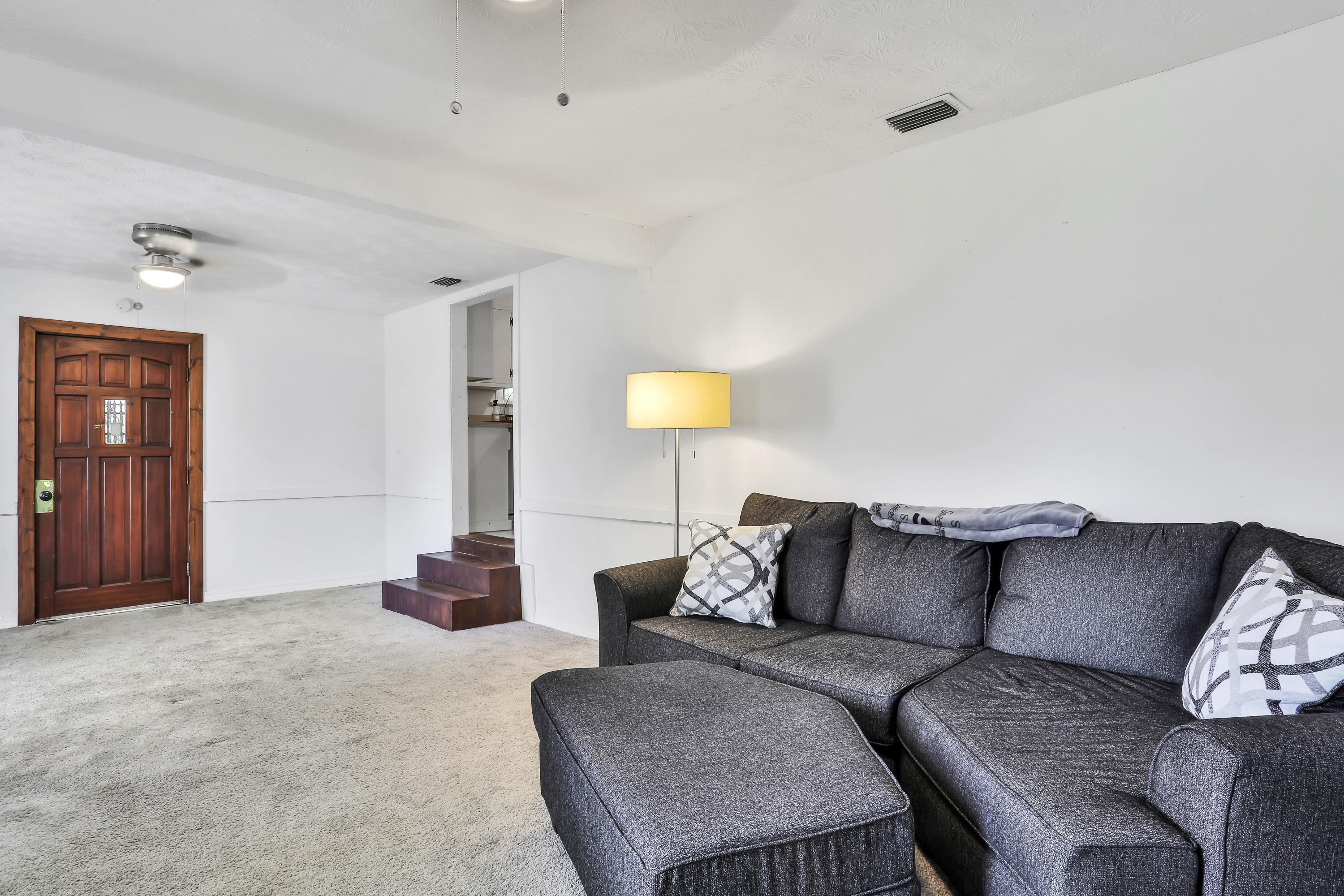 6125 Seaboard Avenue Jacksonville, FL 32244 - Photo 11 of 18 a living room with furniture and a couch