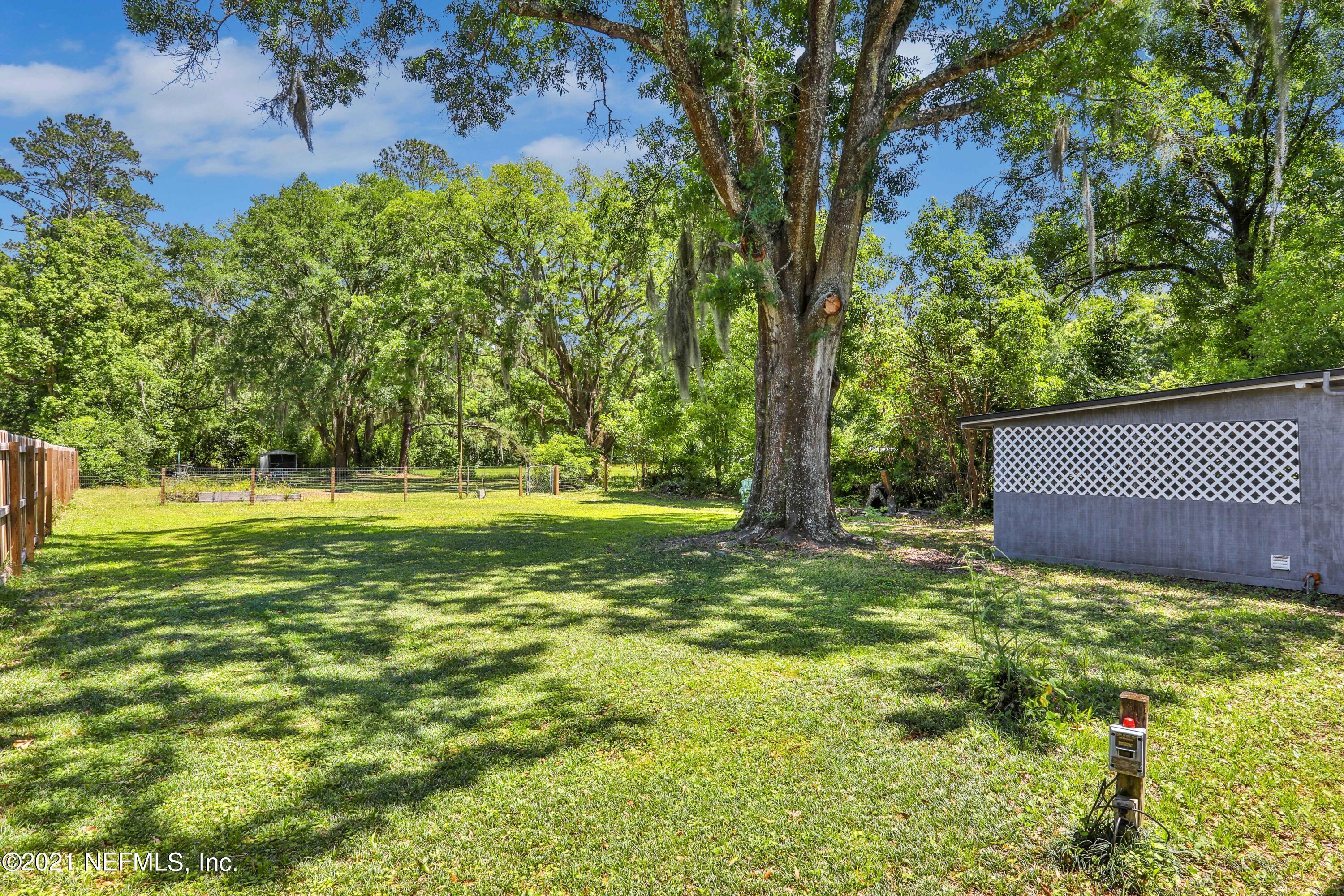 6125 Seaboard Avenue Jacksonville, FL 32244 - Photo 2 of 18 a view of a garden with trees