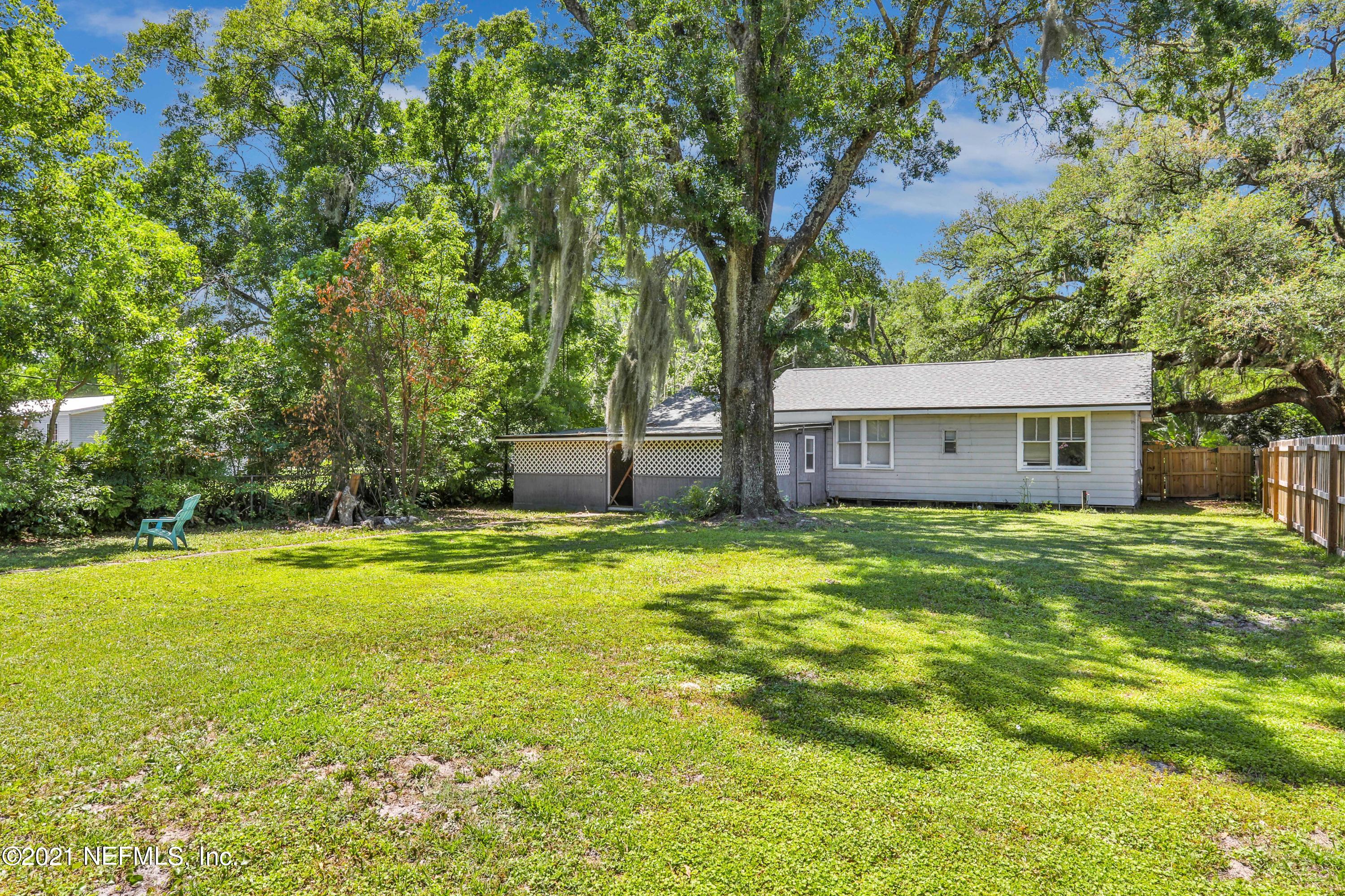 6125 Seaboard Avenue Jacksonville, FL 32244 - Photo 3 of 18 a backyard of a house with table and chairs