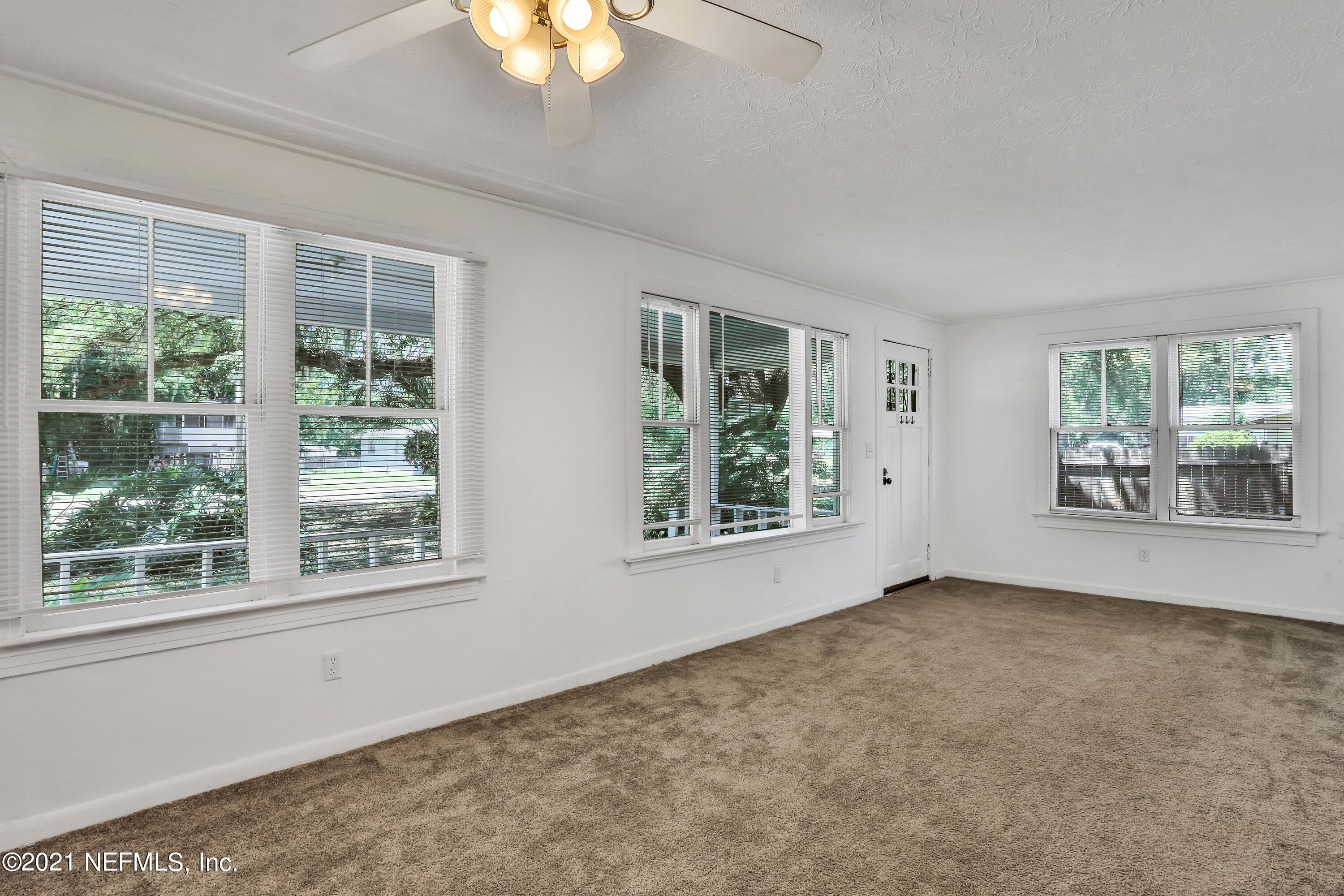 6125 Seaboard Avenue Jacksonville, FL 32244 - Photo 4 of 18 a view of an empty room with windows