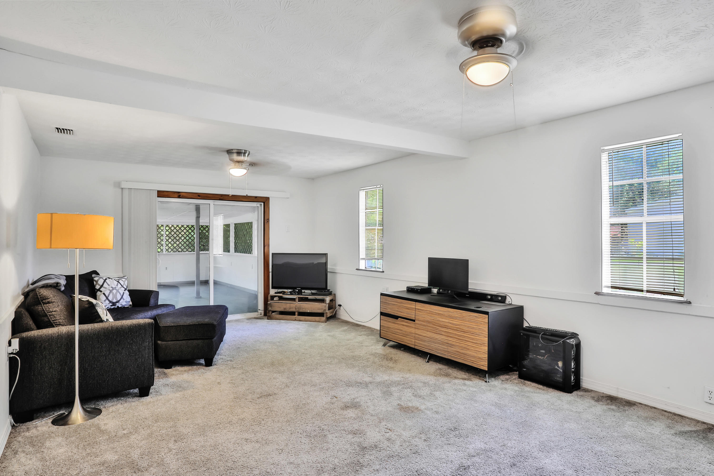 6125 Seaboard Avenue Jacksonville, FL 32244 - Photo 10 of 18 a living room with furniture and a flat screen tv