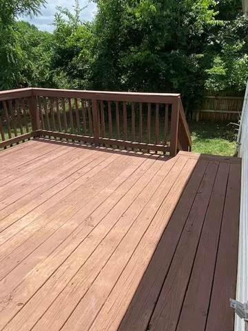a view of balcony with wooden floor