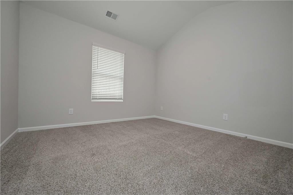 505 Charleston Place Villa Rica, GA 30180 - Photo 23 of 35 an empty room with a window