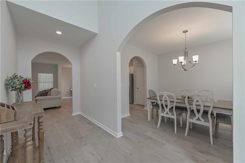 505 Charleston Place Villa Rica, GA 30180 - Photo 4 of 35 a view of a dining room with furniture and wooden floor