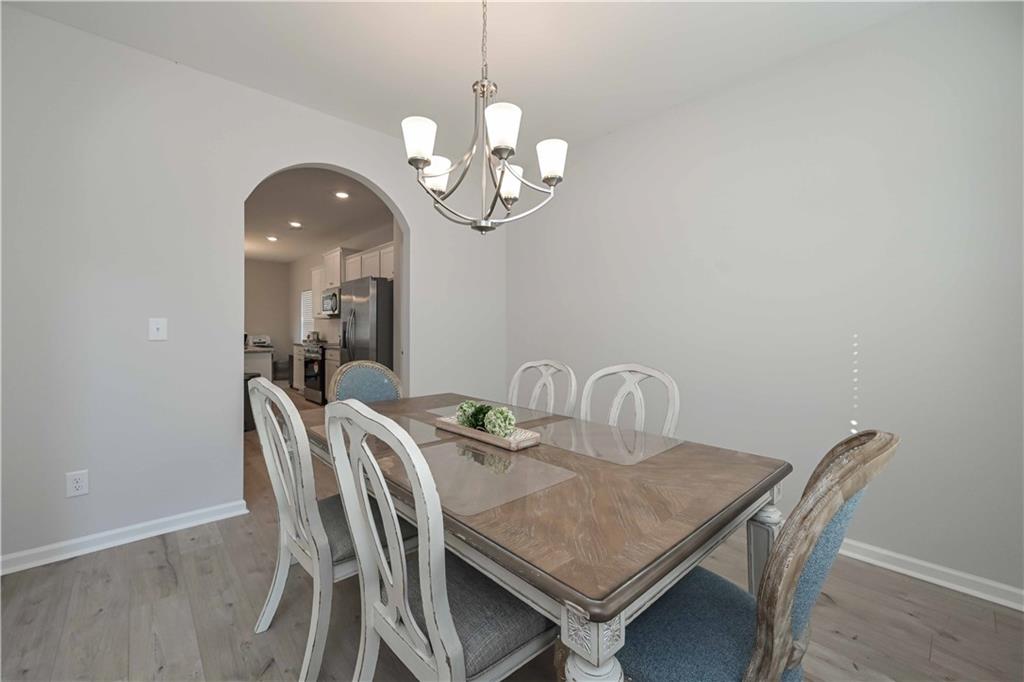 505 Charleston Place Villa Rica, GA 30180 - Photo 6 of 35 a view of a dining room with a table and chairs