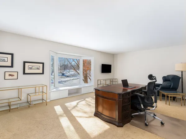 a view of a workspace with furniture and a couch