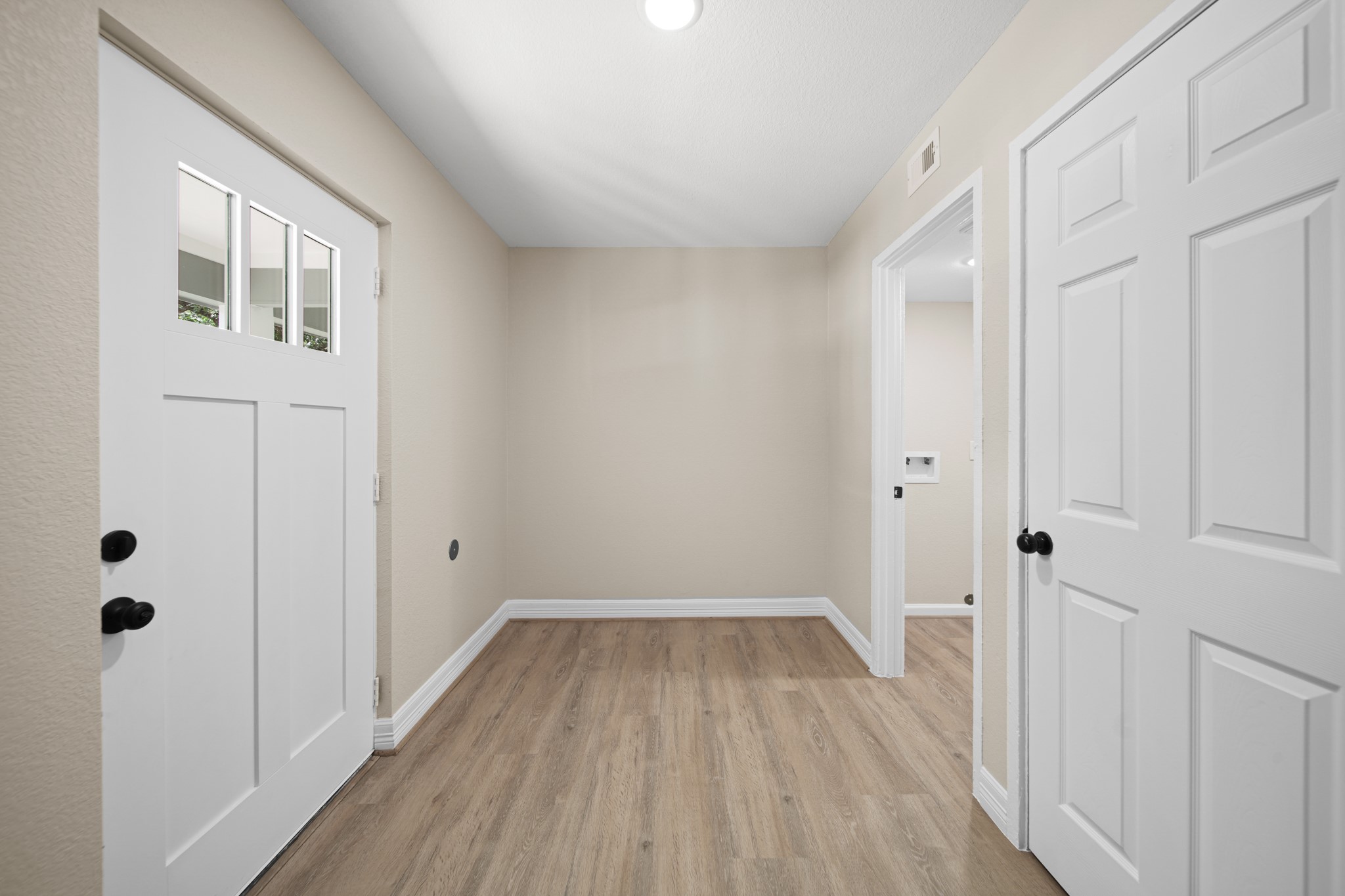 220 Pine Road Clear Lake Shores, TX 77565 - Photo 20 of 31 a view of a room with wooden floor and a hallway