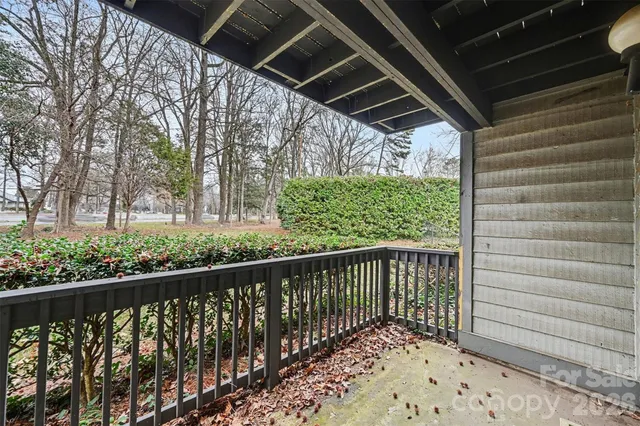 a swimming pool with outdoor seating and yard