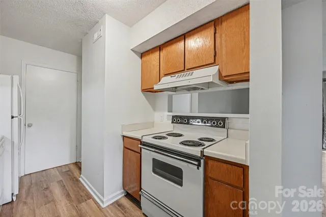 a kitchen with a stove and a microwave
