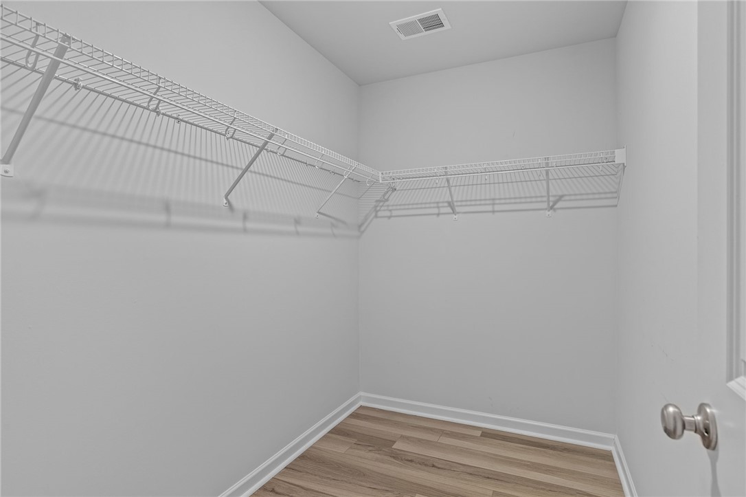 24 Chalet Court Anderson, SC 29621 - Photo 20 of 39 This spacious closet features ample shelving for organized storage.