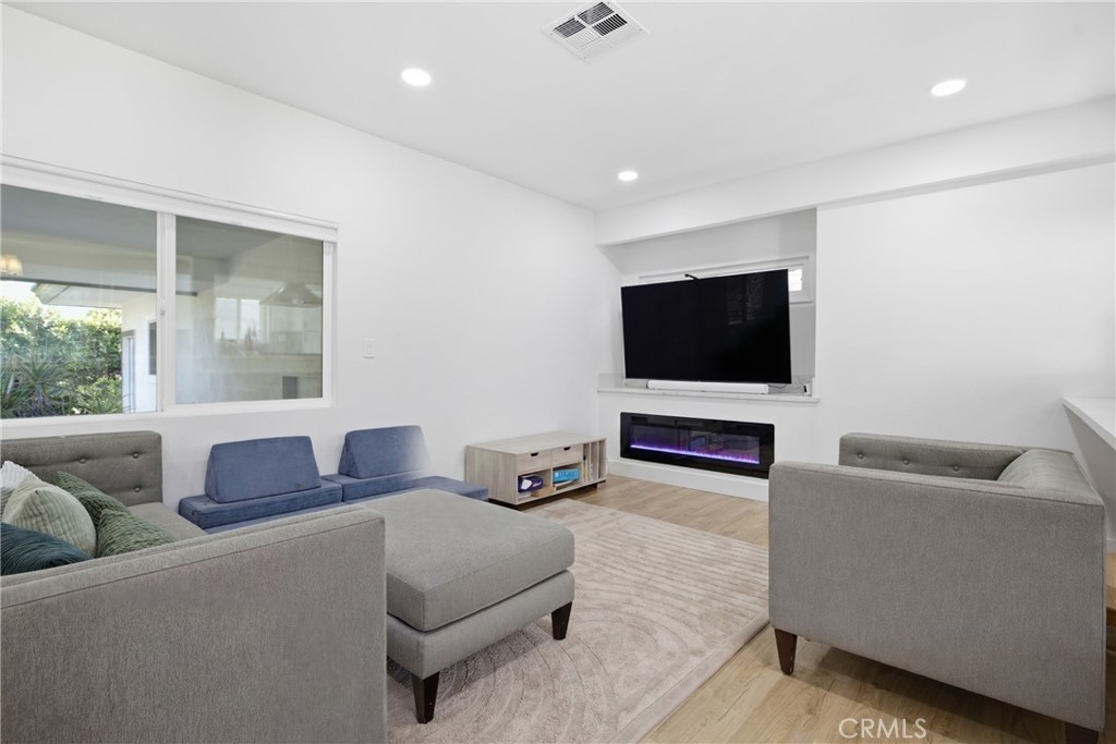 384 Colorado Street Arcadia, CA 91007 - Photo 32 of 51 a living room with furniture and a flat screen tv