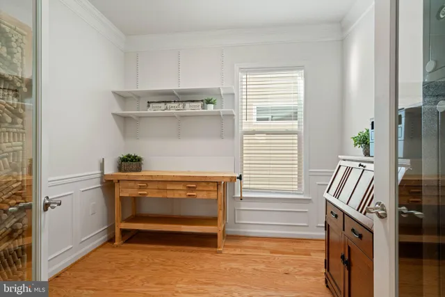 a view of room with window and wooden floor