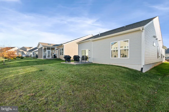 a view of a backyard of the house