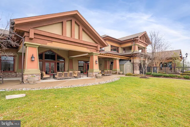 a front view of a house with a street