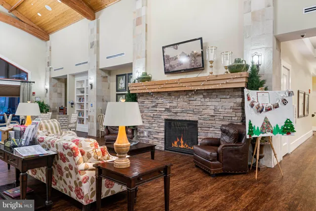 a view of an house with swimming pool and sitting area