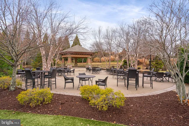 a view of a lake with houses in the back