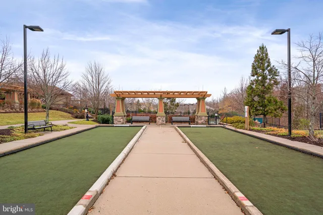 a view of a swimming pool with a lawn chairs
