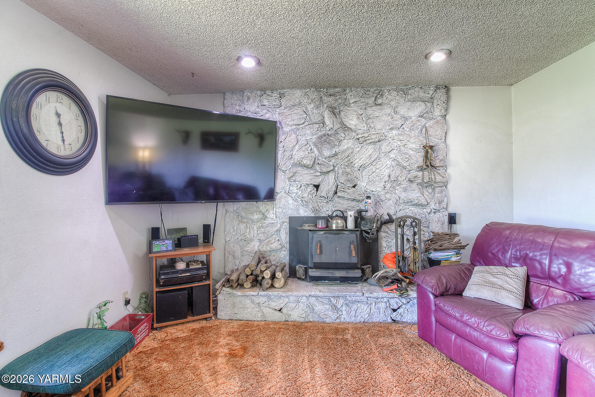 1130 Thompson Road Cowiche, WA 98923 - Photo 10 of 25 a living room with furniture and a fireplace