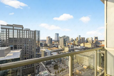 a view of swimming pool from a balcony